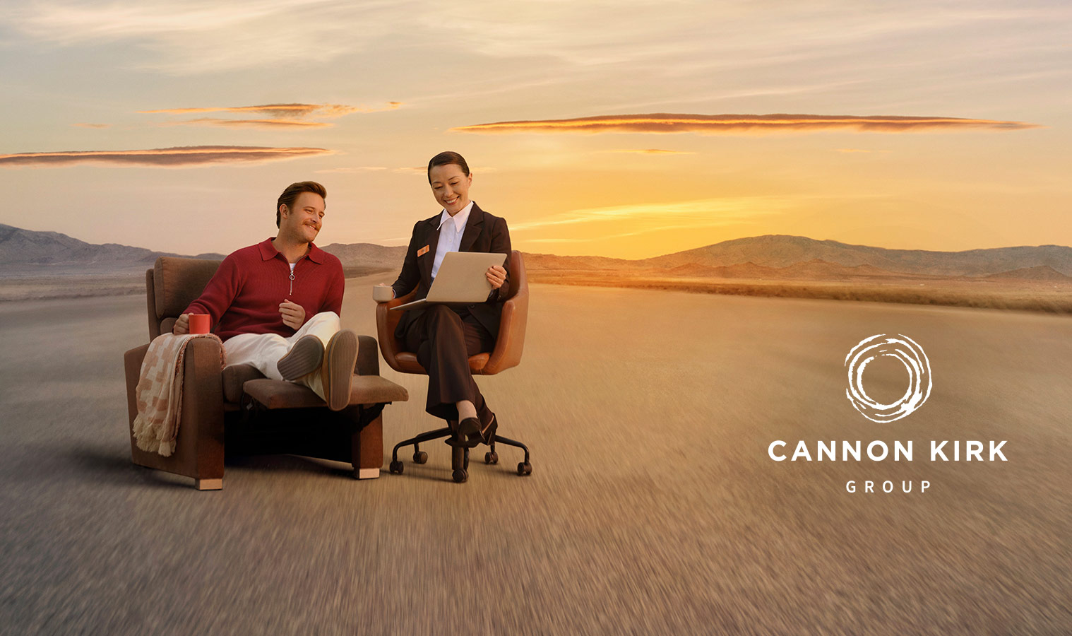 A man sitting on a recliner armchair talking to a mortgage consultant in a barren landscape